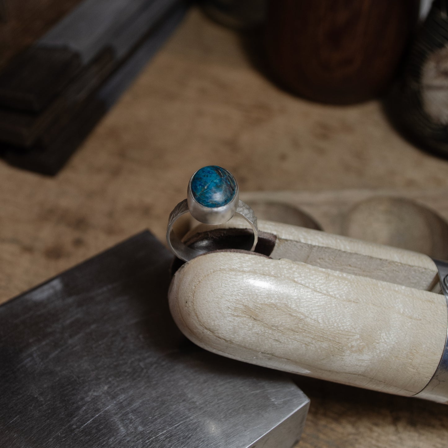 Textured band ring with cabochon-set chrysocolla