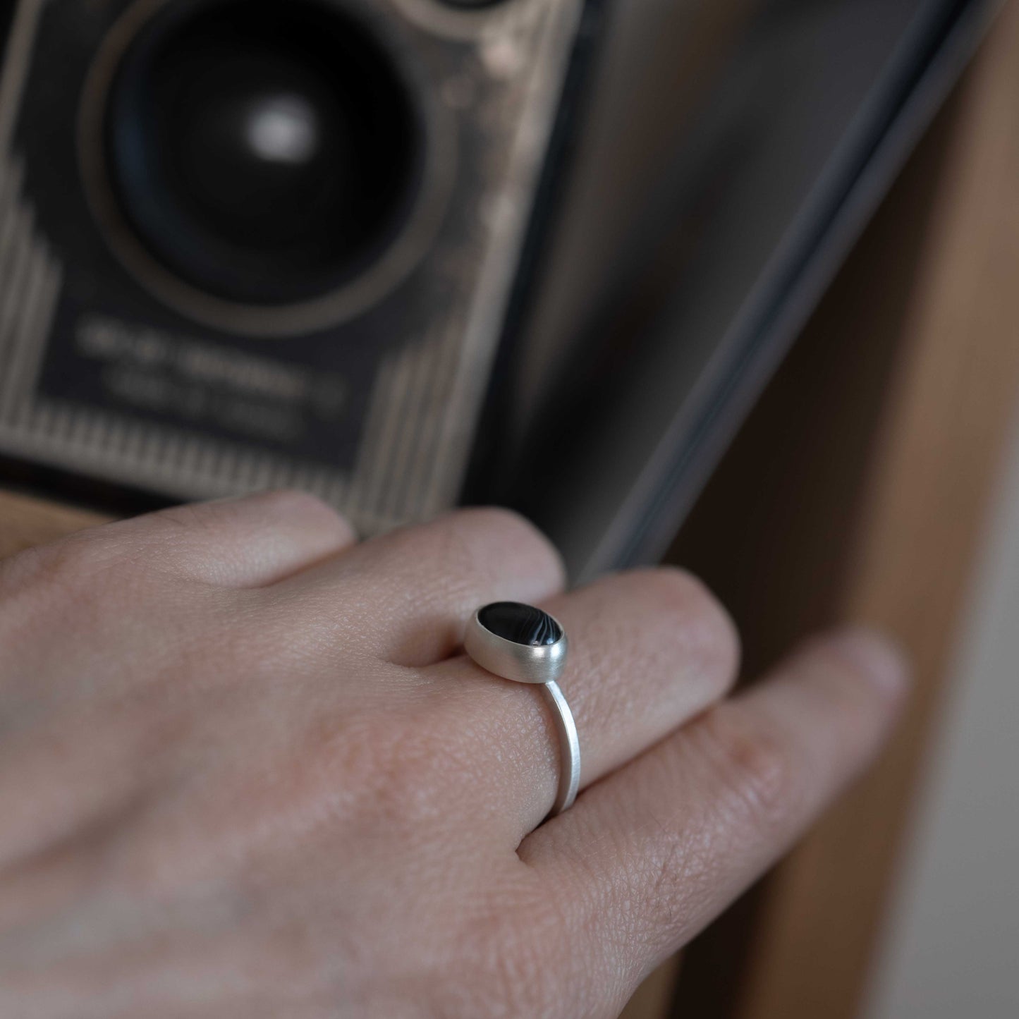 Exquisite silver ring with natural black banded agate stone