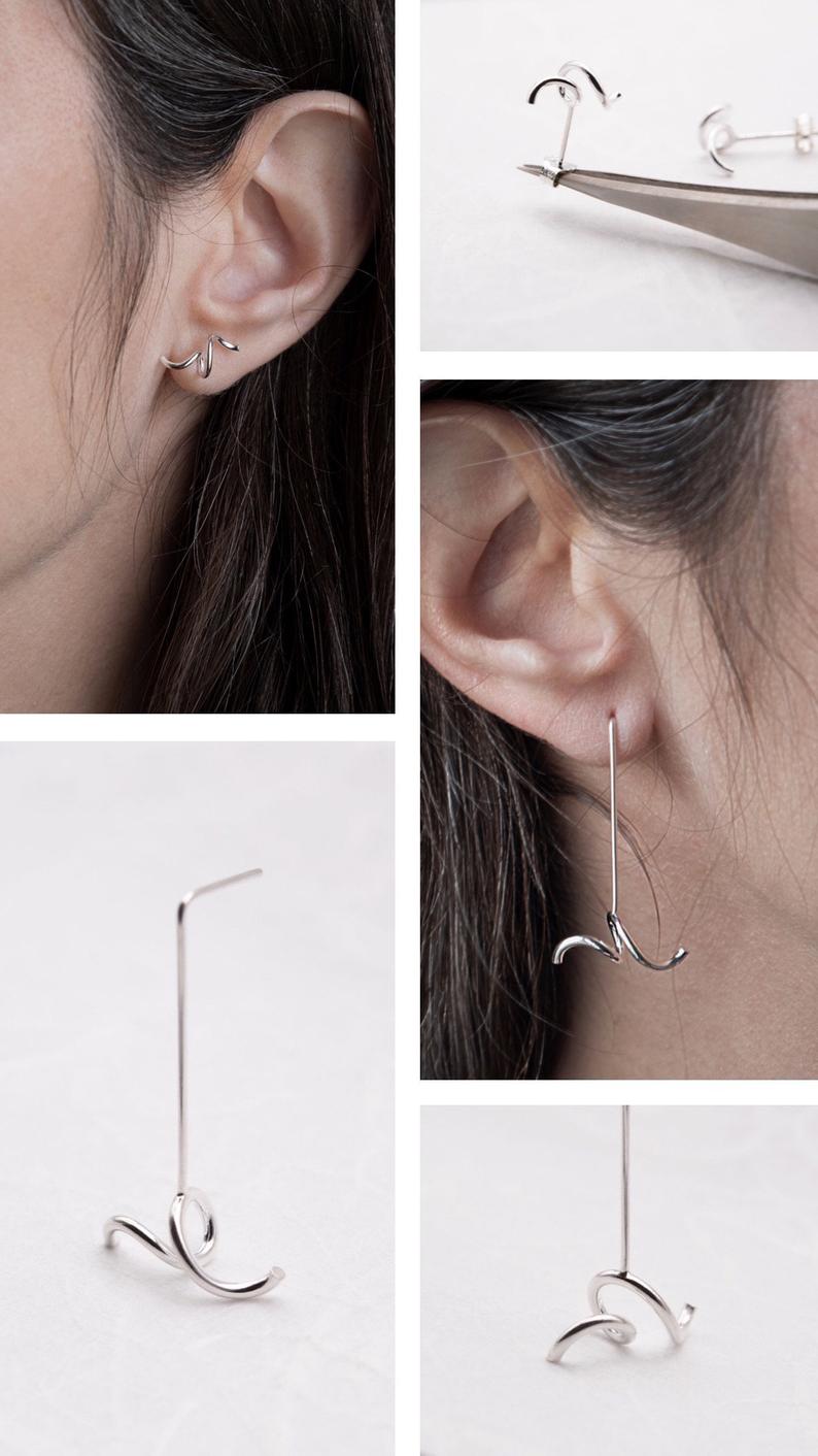 The abstract earrings are twisted by hand from sterling silver so no two are ever exactly the same.