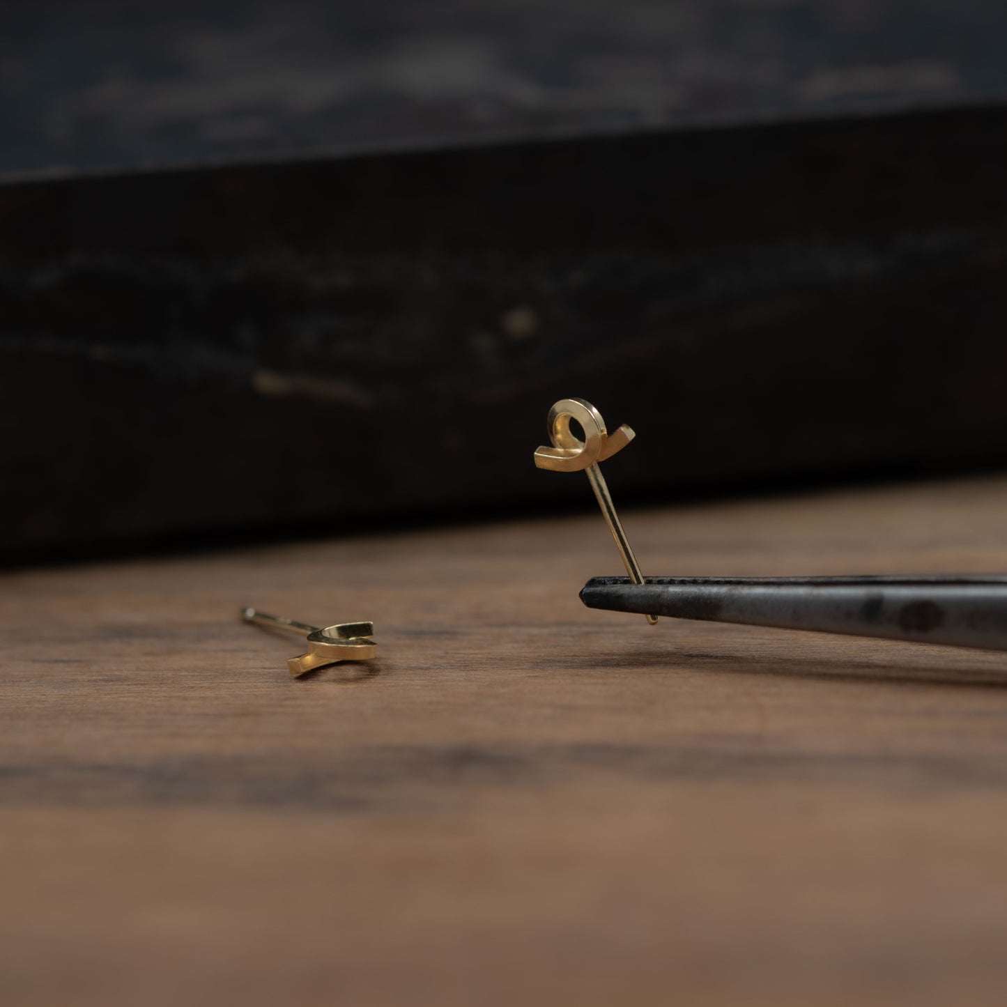 Tiny loop studs earrings crafted by hand from a 1,5 mm square wire of sterling silver and then shiny finished and gold plated. Length: 5 Millimeters; Width: 7 Millimeters