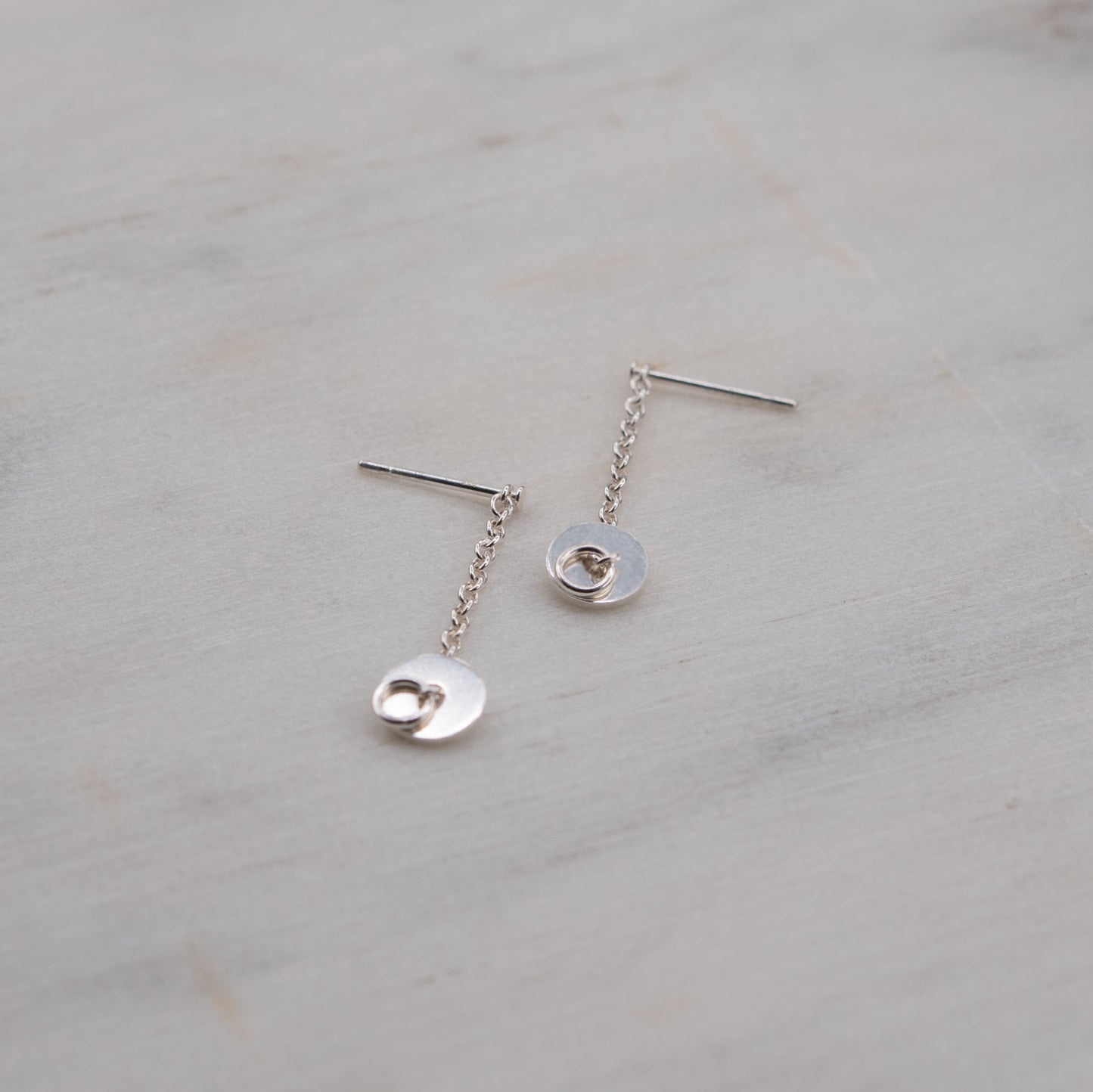 Short silver chain earrings with disc pendants