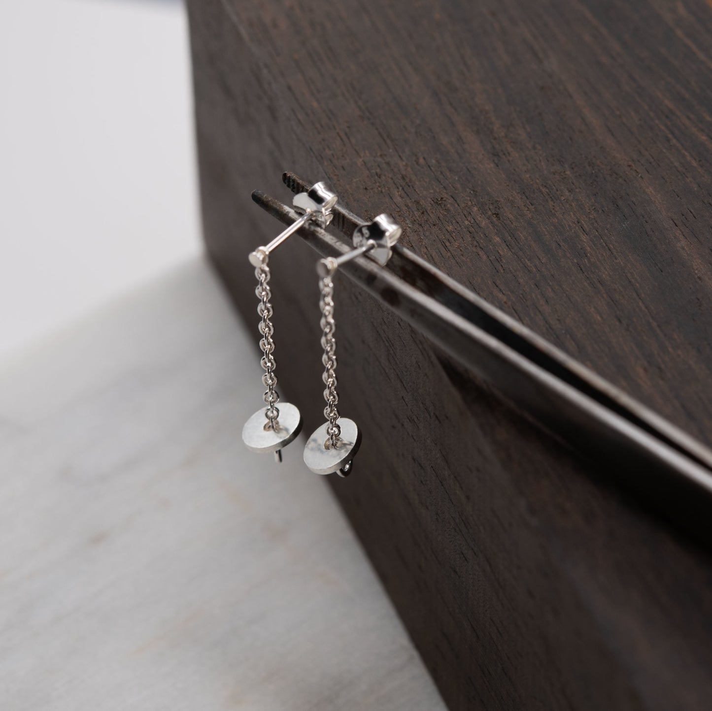 Short silver chain earrings with disc pendants