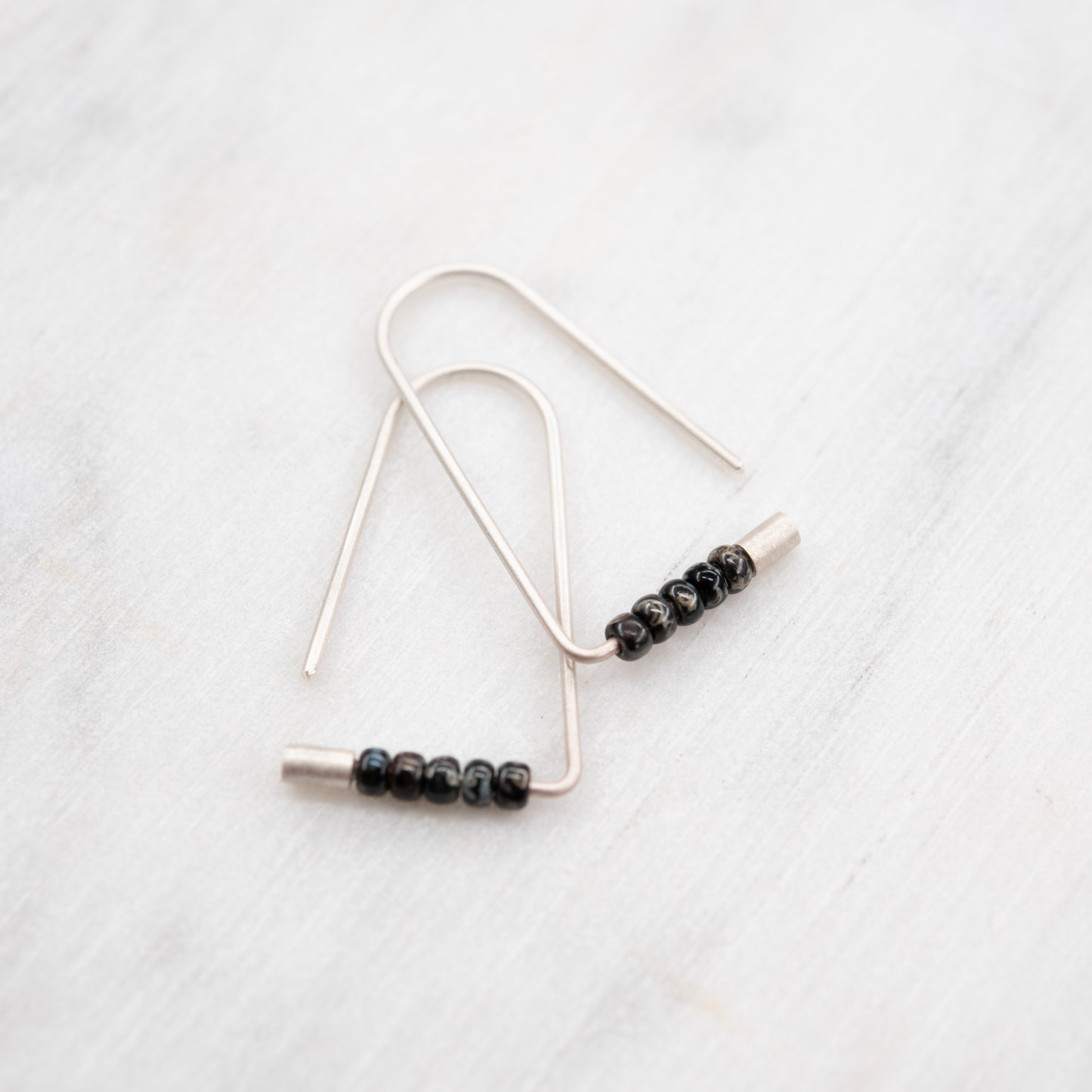 Geometric sterling silver earrings with a subtle touch of black from Miyuki beads.