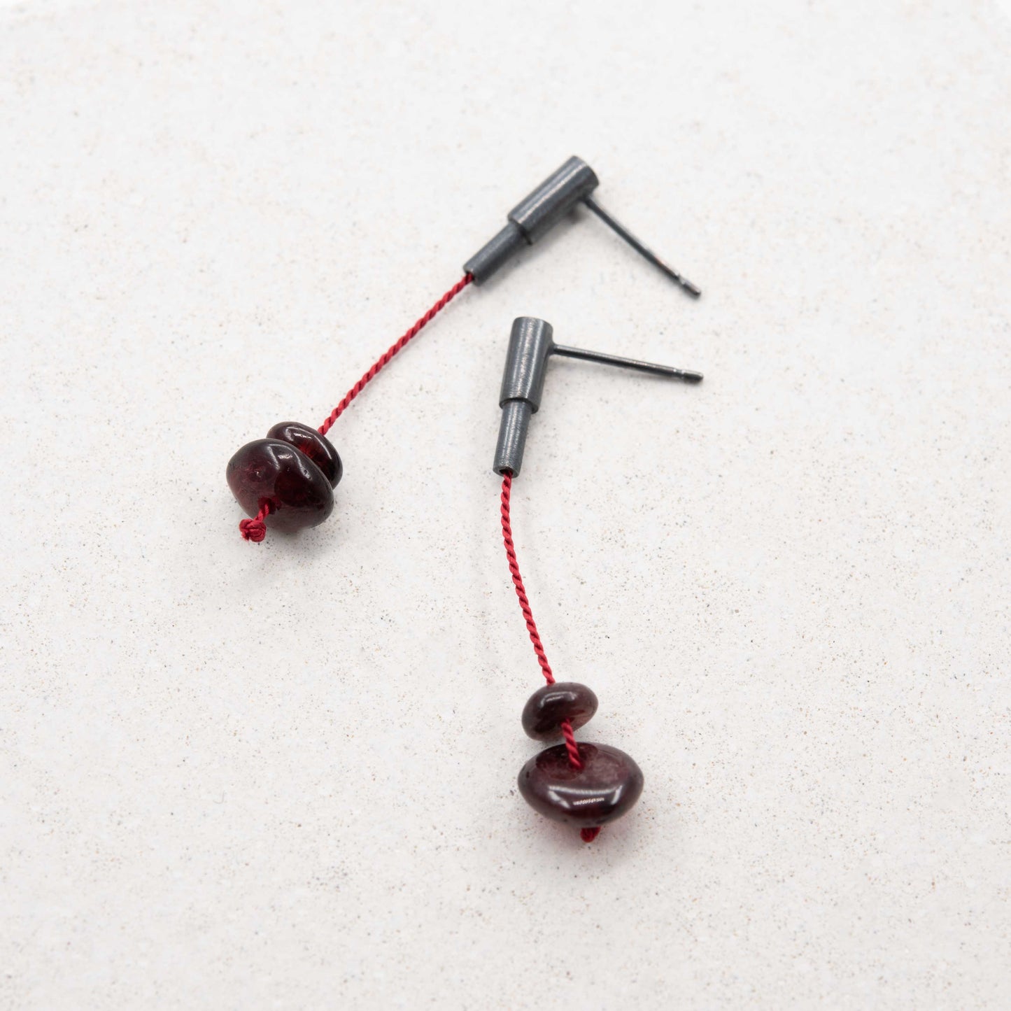 Garnet stone dangle earrings in oxidized silver with red silk cord