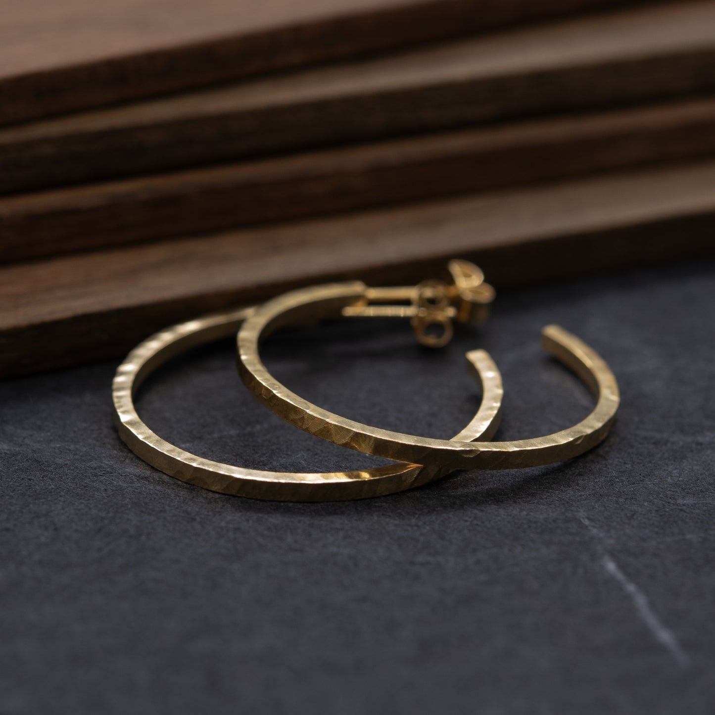 Close-up of hammered texture on large gold vermeil hoops – AgJc handmade
