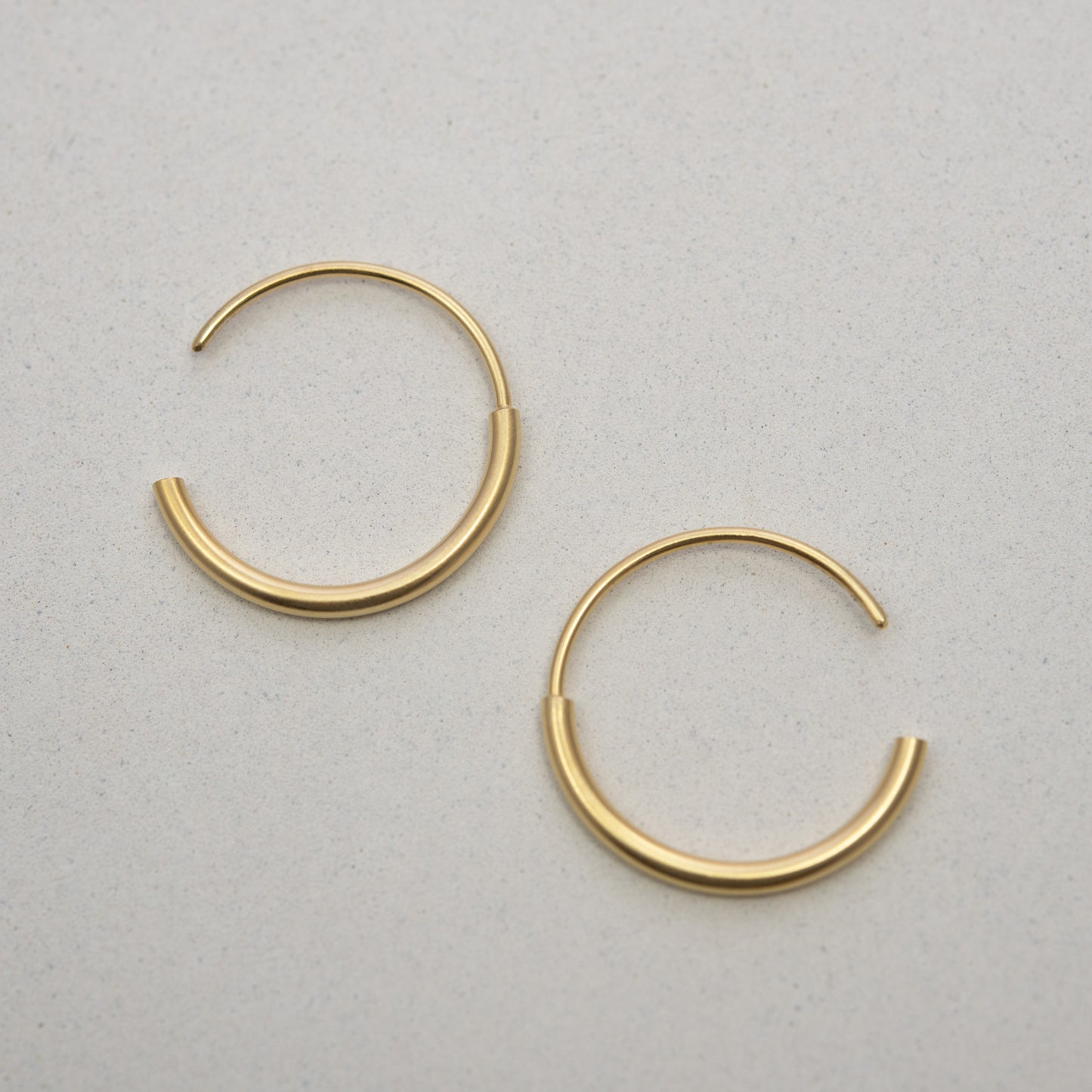 Handcrafted gold hoops by AgJc