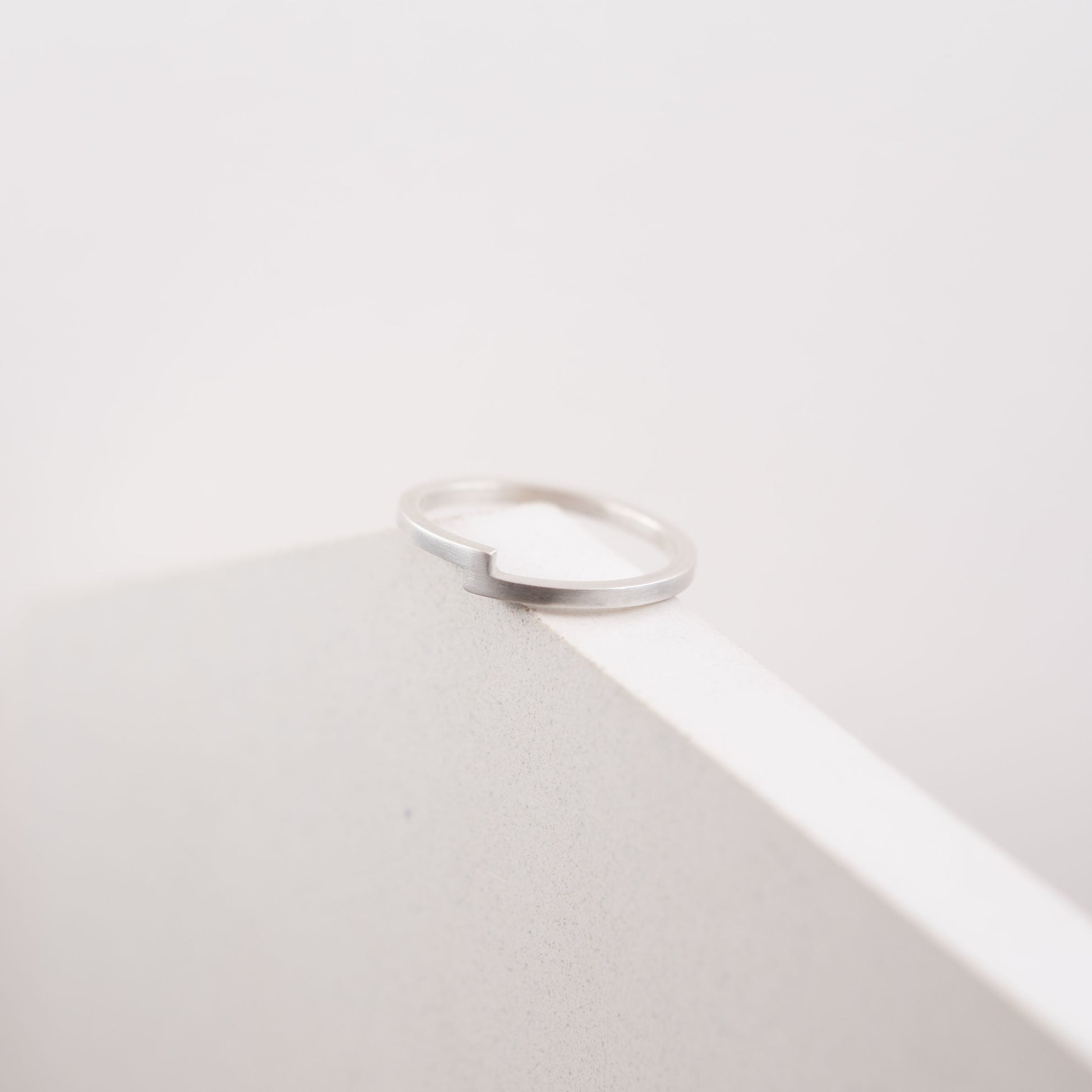 Thin band silver ring. Crafted by hand by a g j c from a 1,5 mm square shape band of solid sterling silver.
